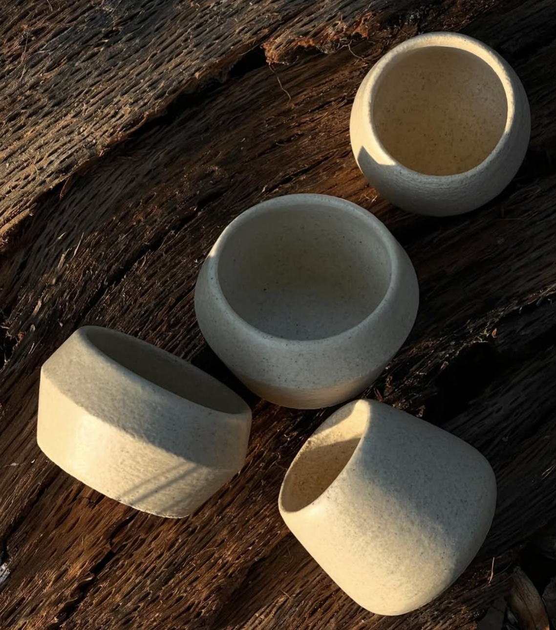 Small ceramic vessels on wood